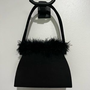 Small evening bag with handles.